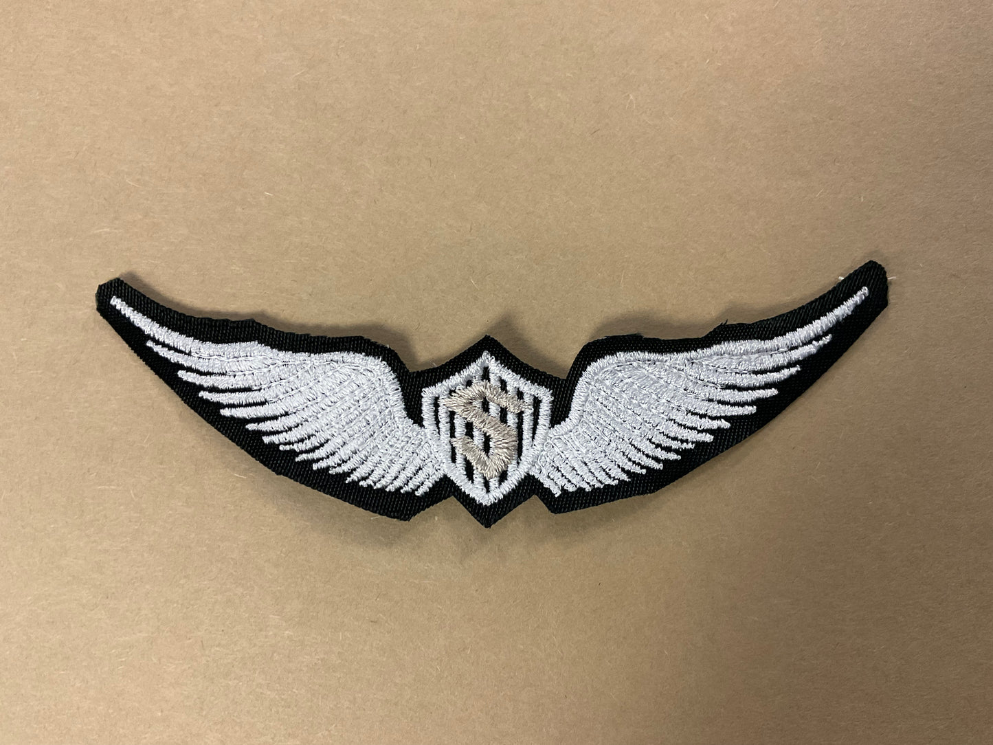 
                  
                    Embroidered Solo Wings
                  
                