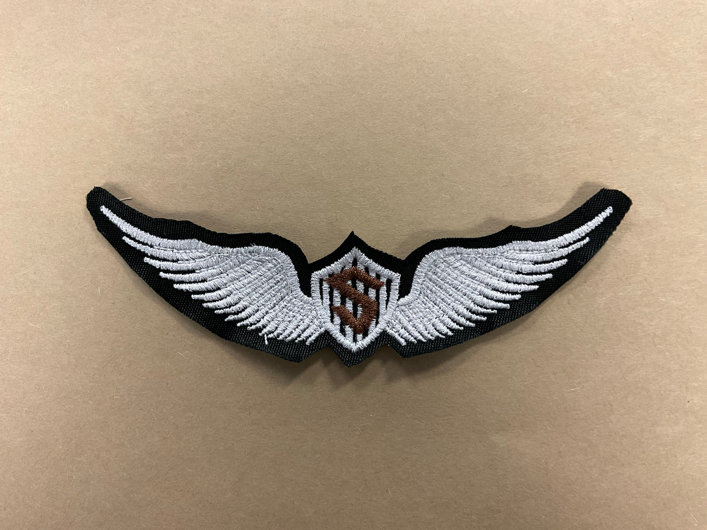 
                  
                    Embroidered Solo Wings
                  
                