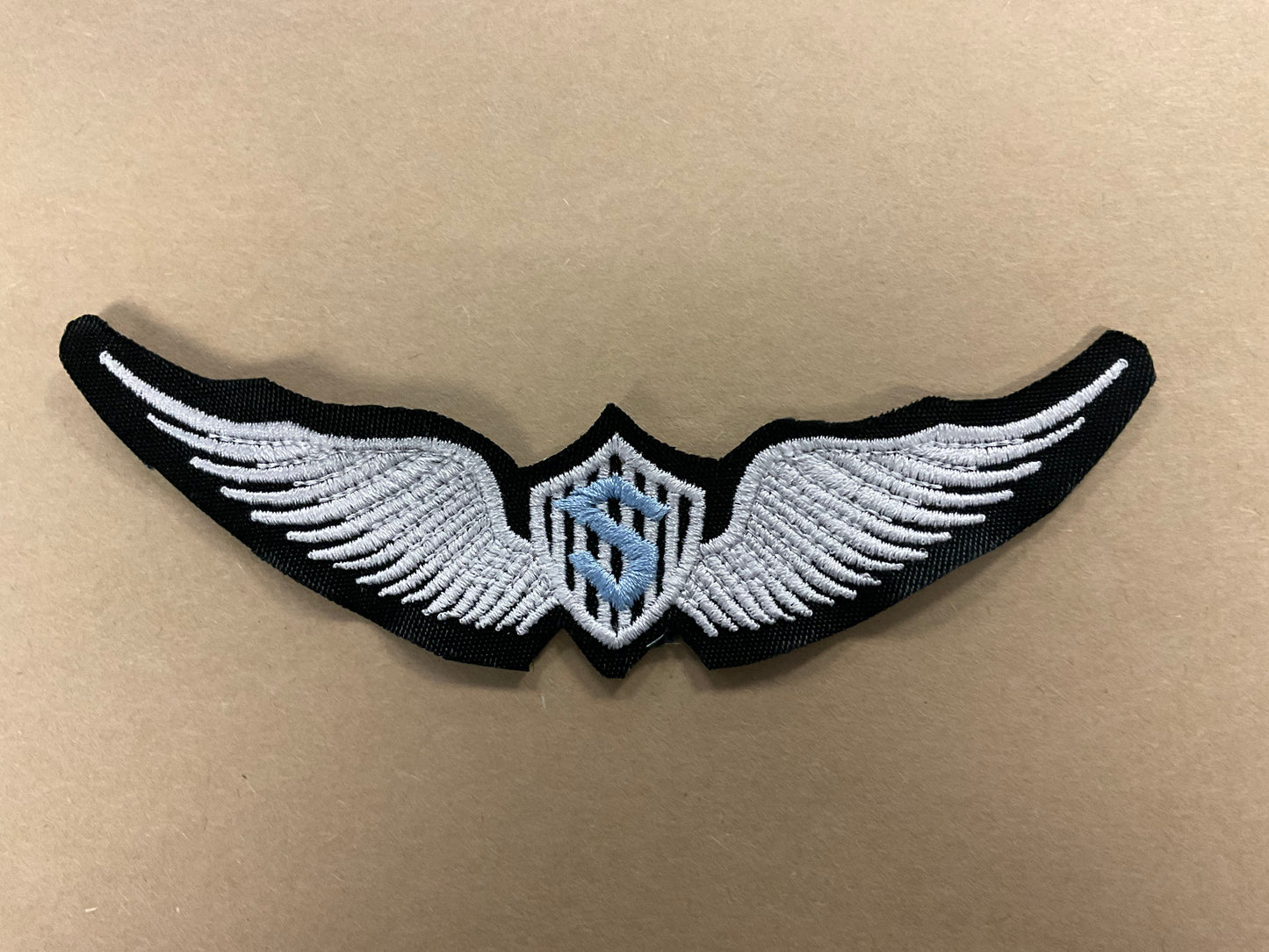 
                  
                    Embroidered Solo Wings
                  
                