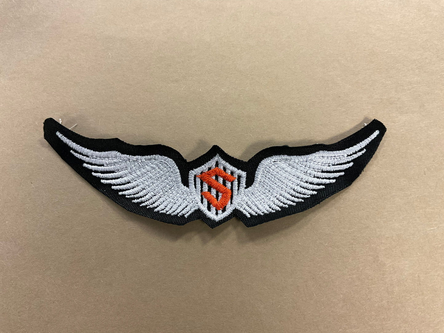 
                  
                    Embroidered Solo Wings
                  
                