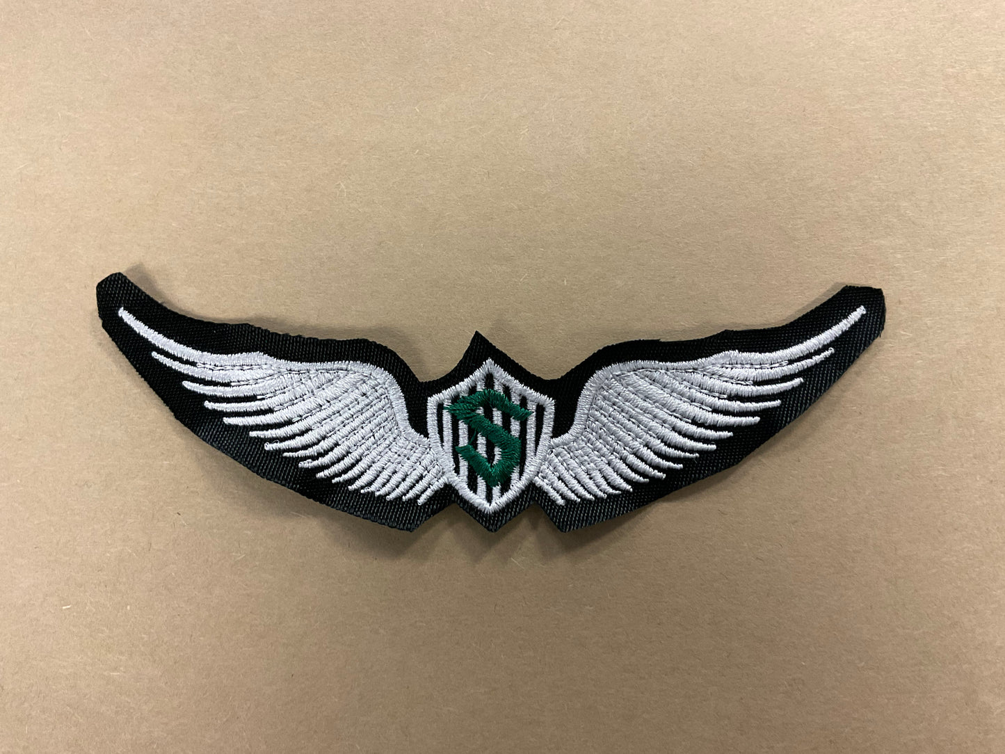 
                  
                    Embroidered Solo Wings
                  
                