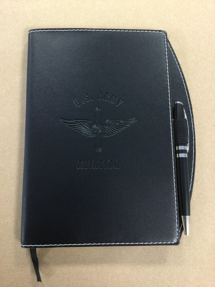 
                  
                    Army Aviation Journal with pen
                  
                